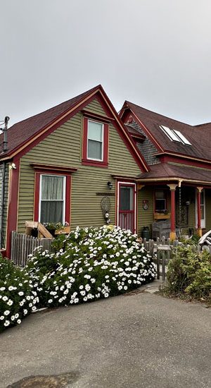 Charming Victorian house with garden and red trim